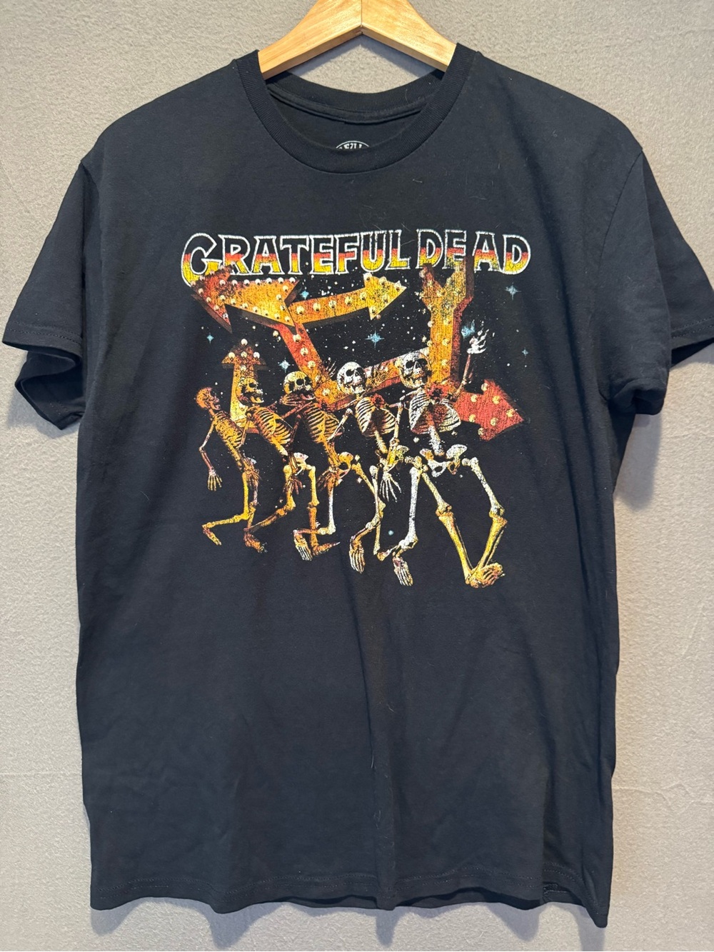 Grateful Dead Black Tee with Yellow-Orange Skeleton Parade Graphic